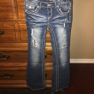 Flare styled ripped jeans.