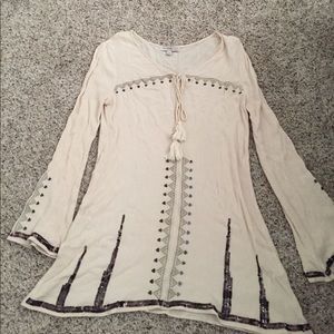 long sleeve cream colored dress with detail