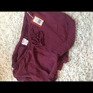Maroon shorts.