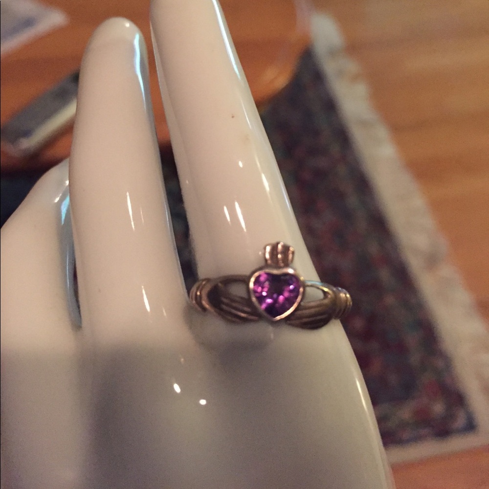 Purple claddagh ring.