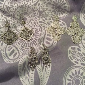 Set of three silver dangly earrings