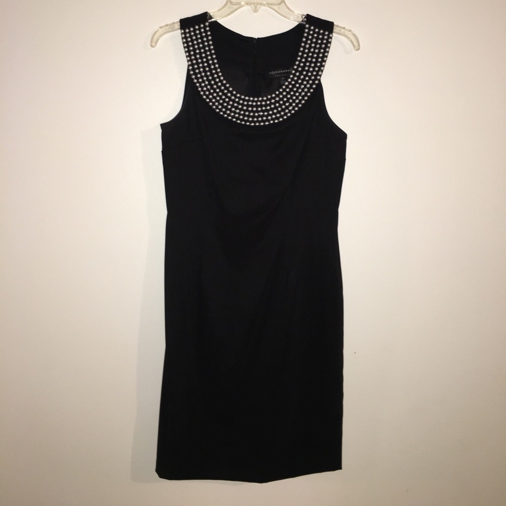 Black dress with pearls on the chest