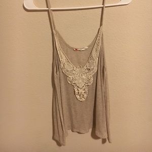 Cream sleeveless blouse