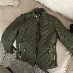 Green quilted jacket.