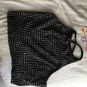 Crop tight tank top with reversed straps.