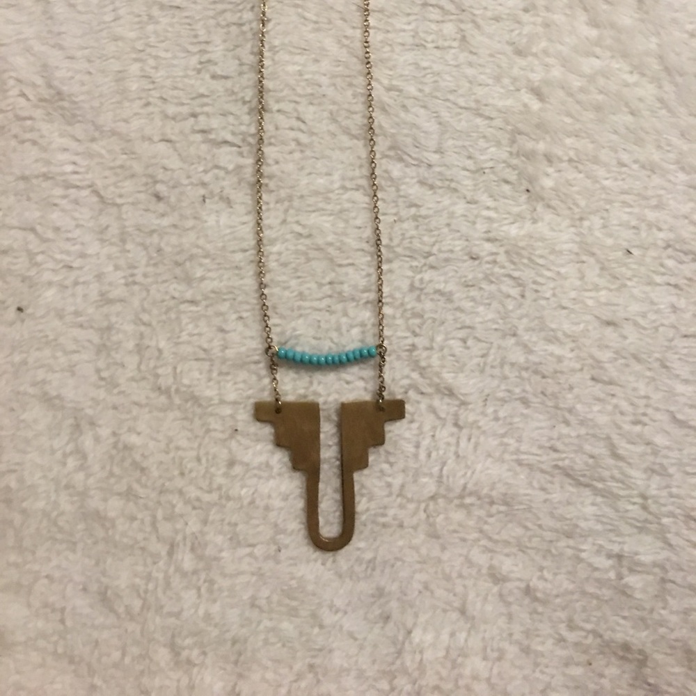 Long gold tone necklace with turquoise beads