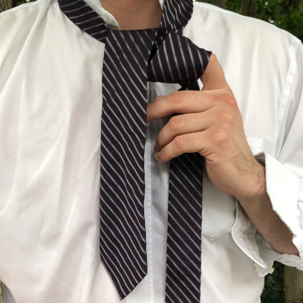 Burgundy striped silk tie by Calvin Klein