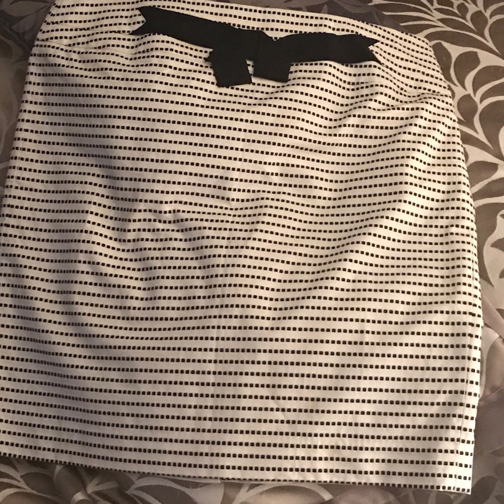 White skirt with black "dots".