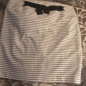 White skirt with black "dots".