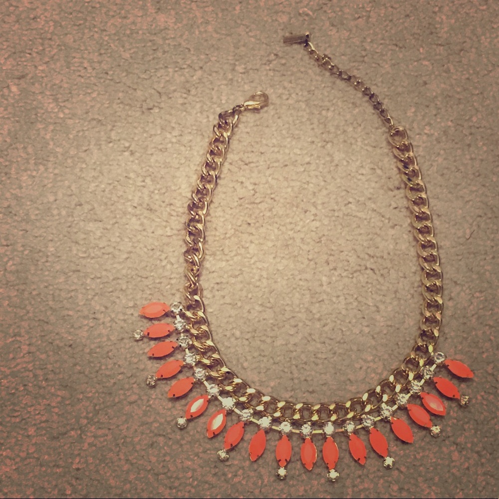 Gold bib necklace with coral stones