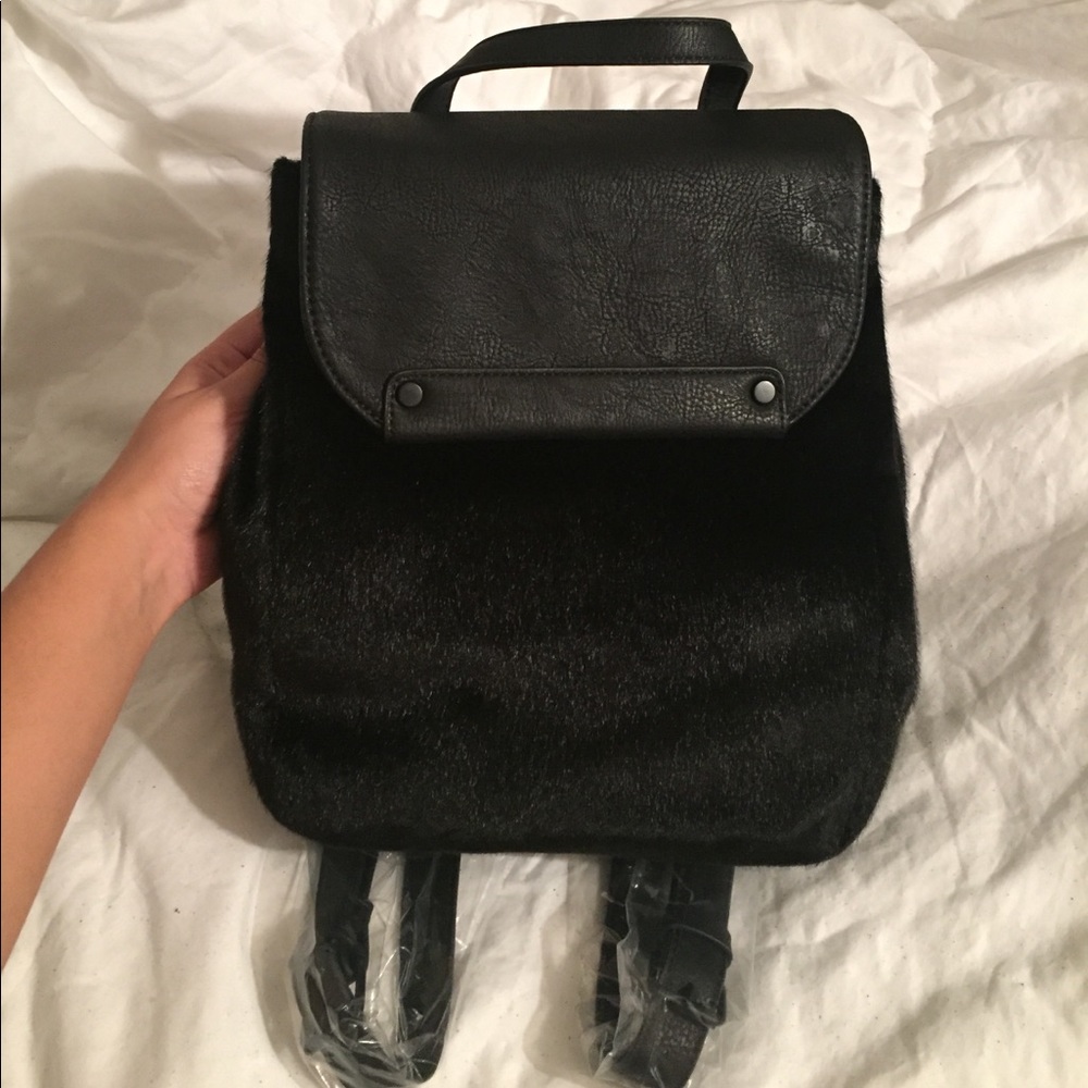 BCBG Faux fur backpack with long pleather straps