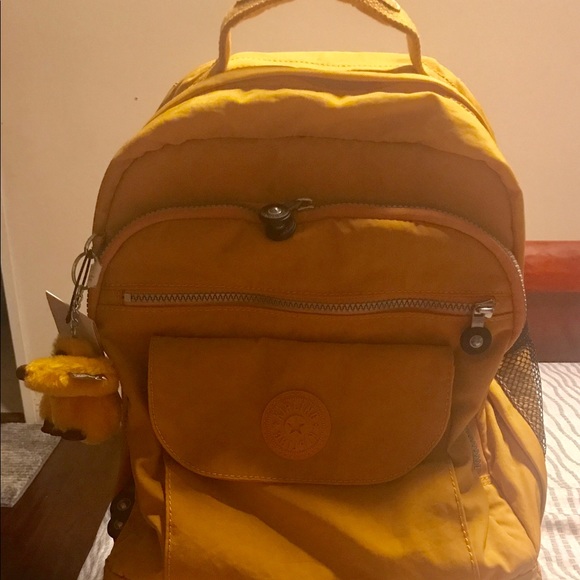 Kipling Really cute rolling backpacks 🎒 in yellow color from Engy's