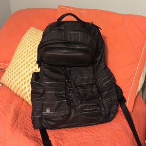 Lululemon black hiking and adventure backpack.