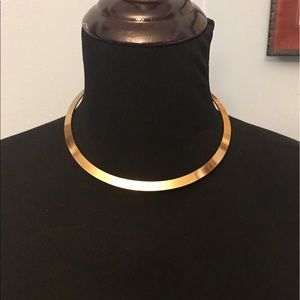 Gold colored necklace