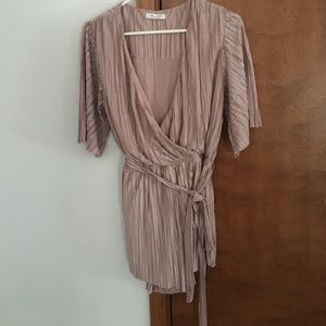 A gorgeous never worn pink/silver romper