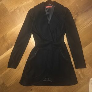 Black wool double breasted coat .