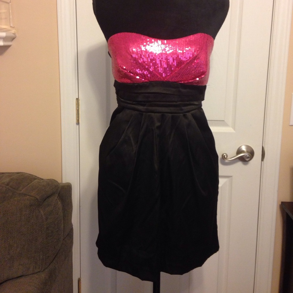 Pink sequins top of black silky strapless dress