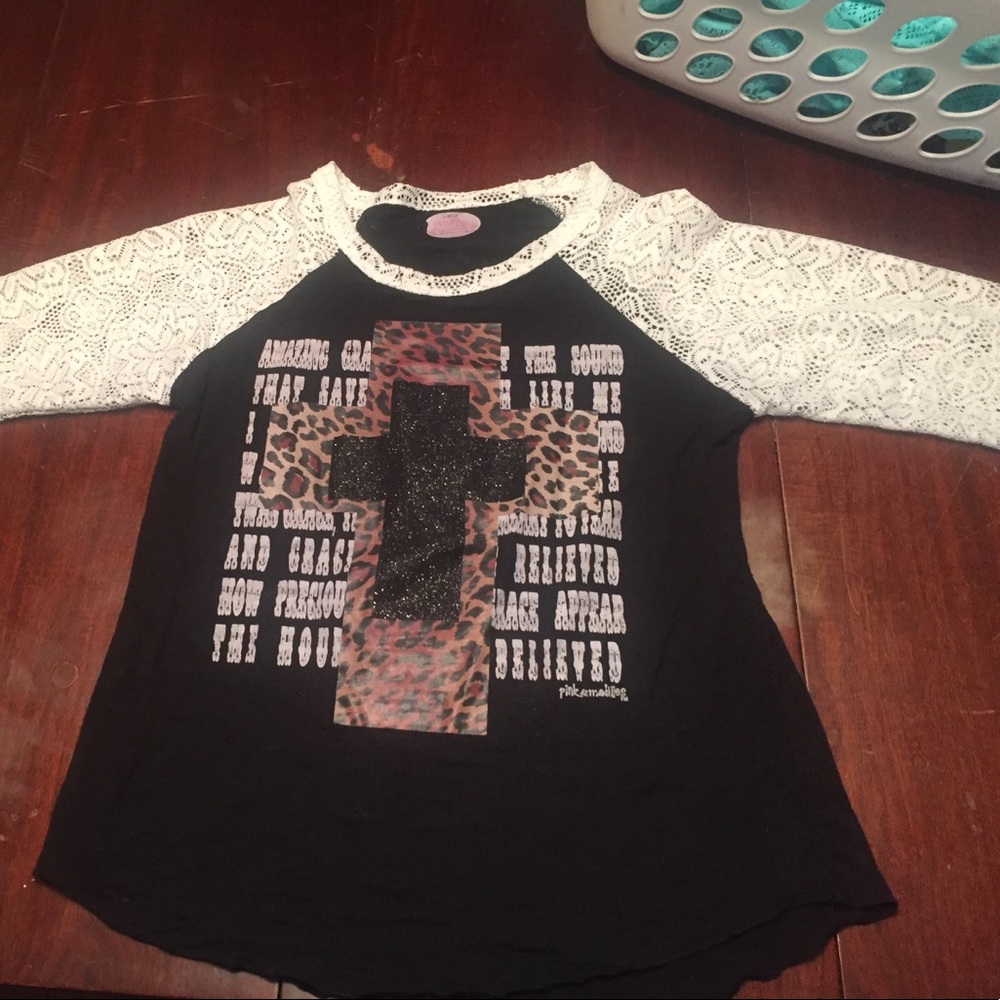 Black top with white lace sleeves.