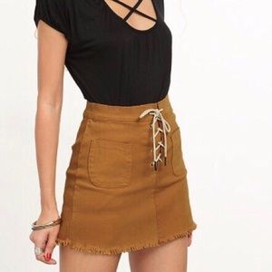 Mustard yellow lace up hem skirt