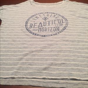 Blue and whit striped top with quote in the middle