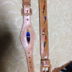 Leather belt with colorful woven insert.