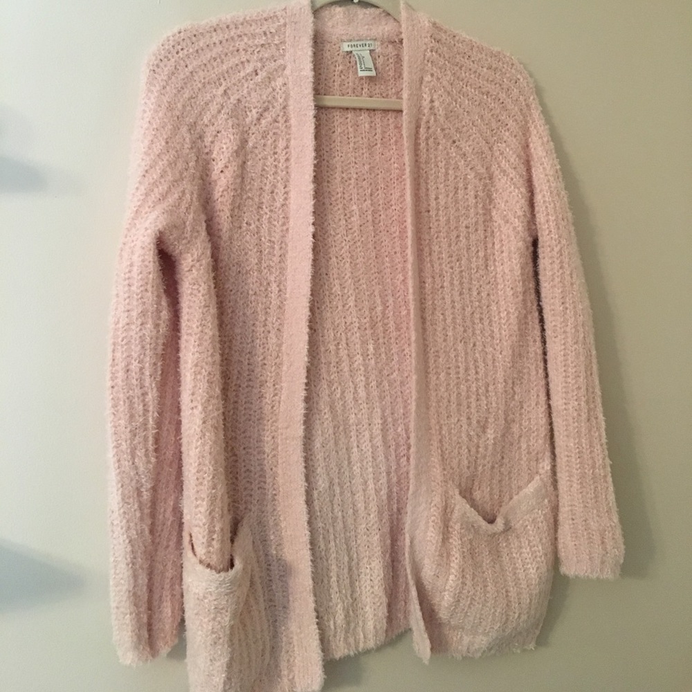 Super fuzzy light pink sweater.