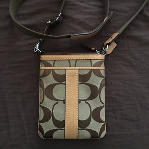 I am selling a Coach Signature Cross Body Purse.