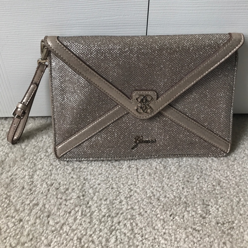 NWOT GUESS gold tone clutch/wristlet
