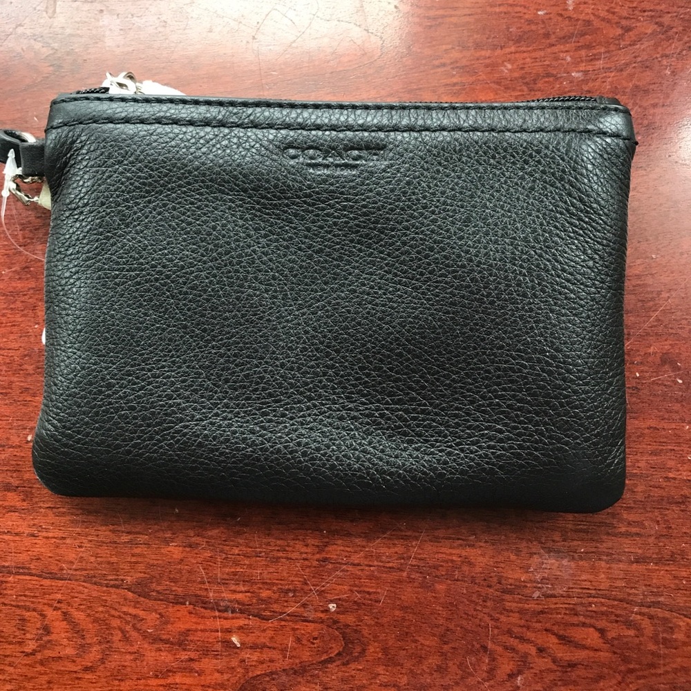 NWT COACH wristlet in black with brown finishes