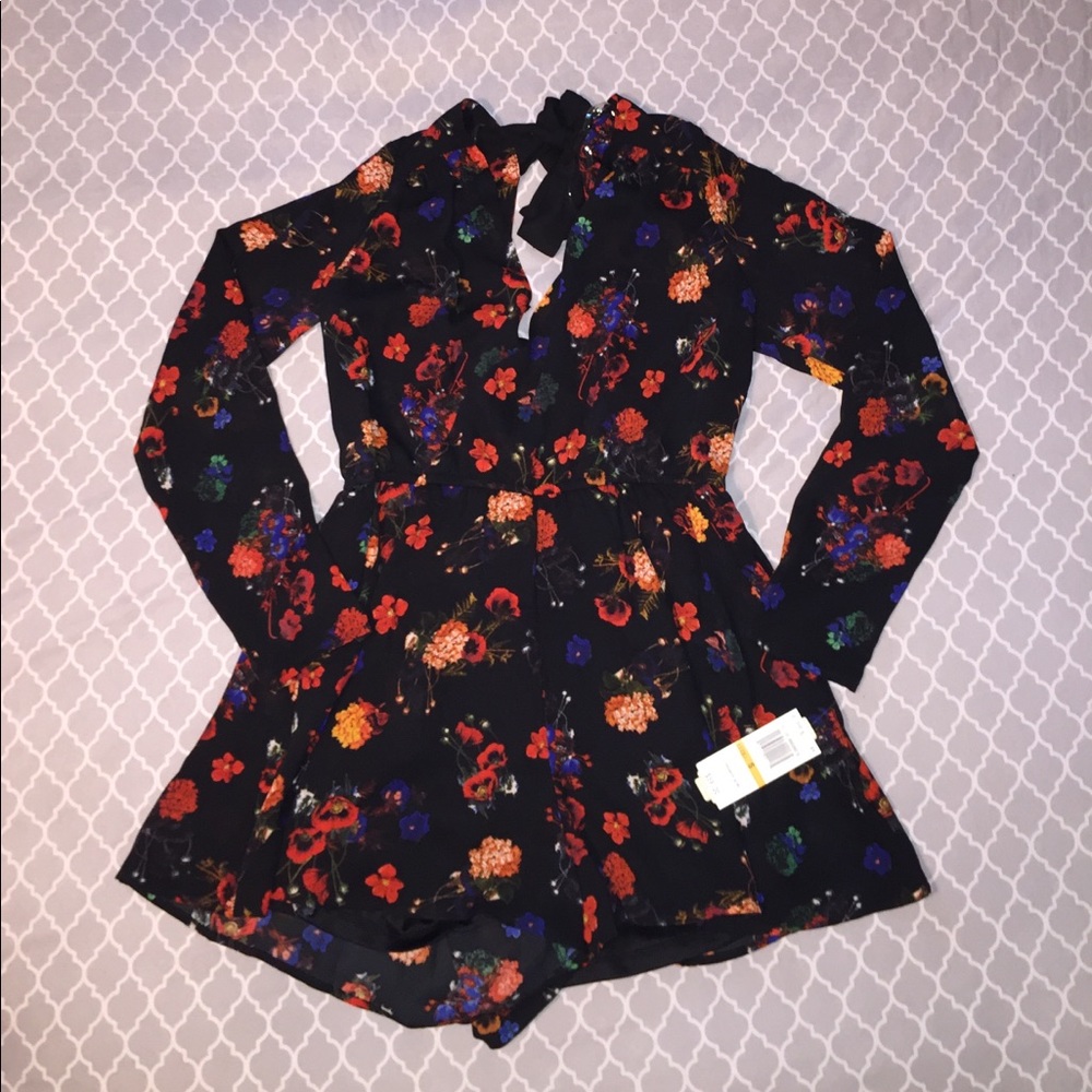 SOLD!! Red on black floral must have romper!