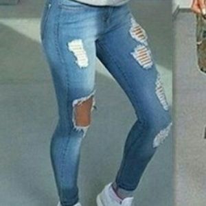 Womans distressed skinny jeans