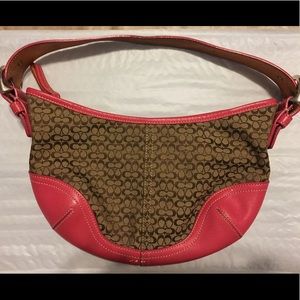 Lightly used Coach handbag with pink leather trim