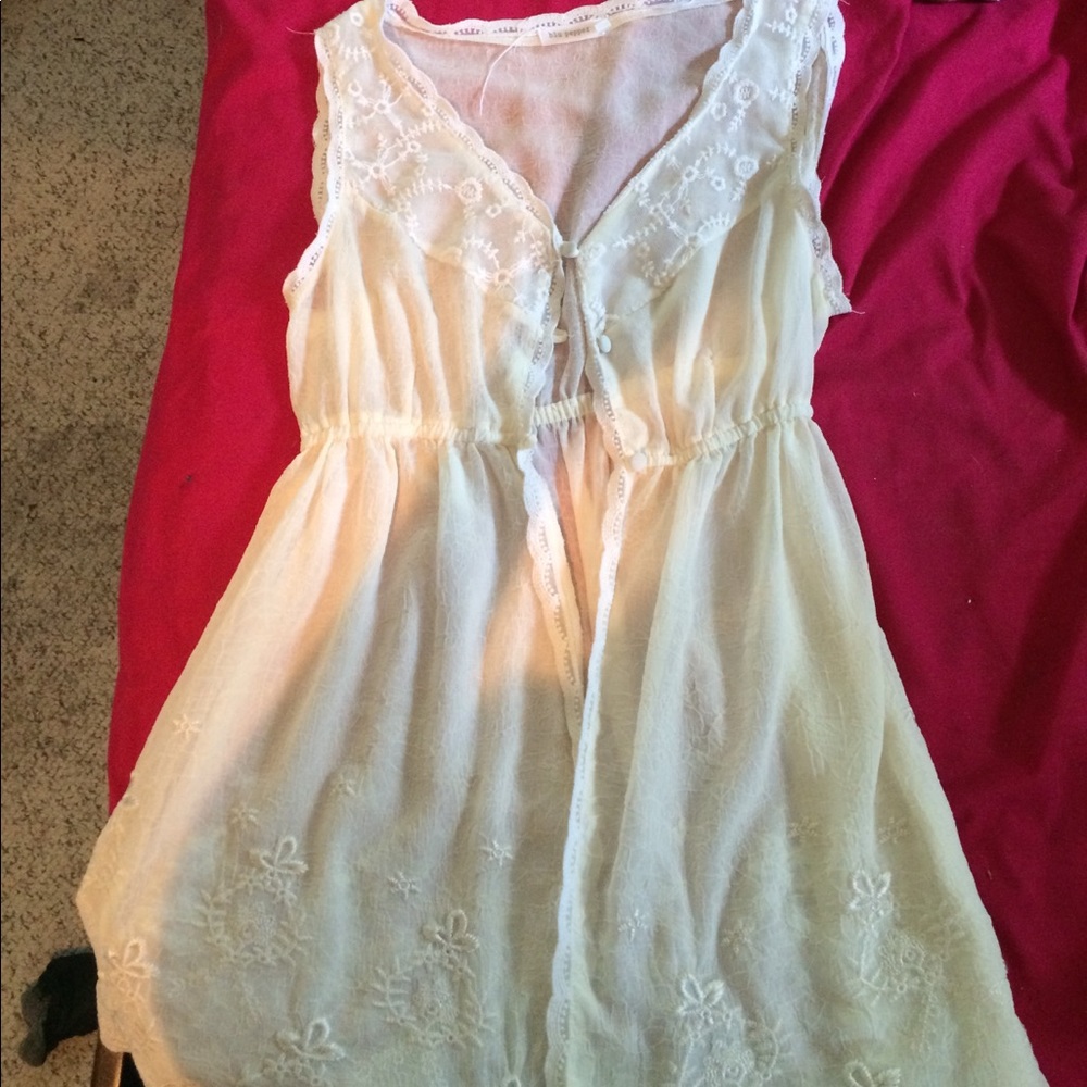 White blouse with lace and floral designs
