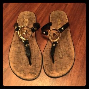 Michael Kors black flip flops
