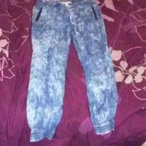 A pair of acid wash denim joggers