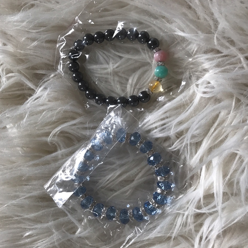 2 unopened bracelets in original packet