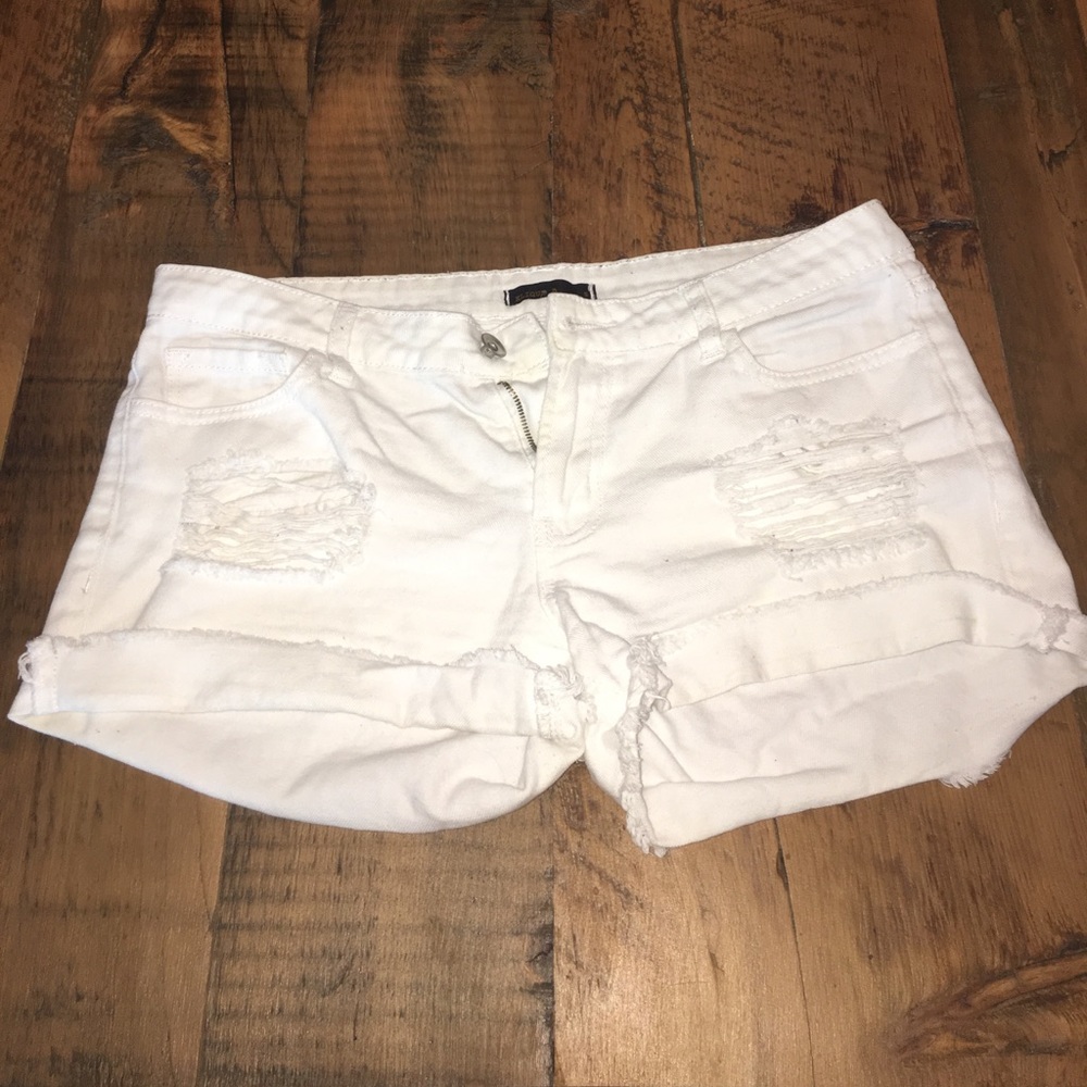 White ripped jean shorts