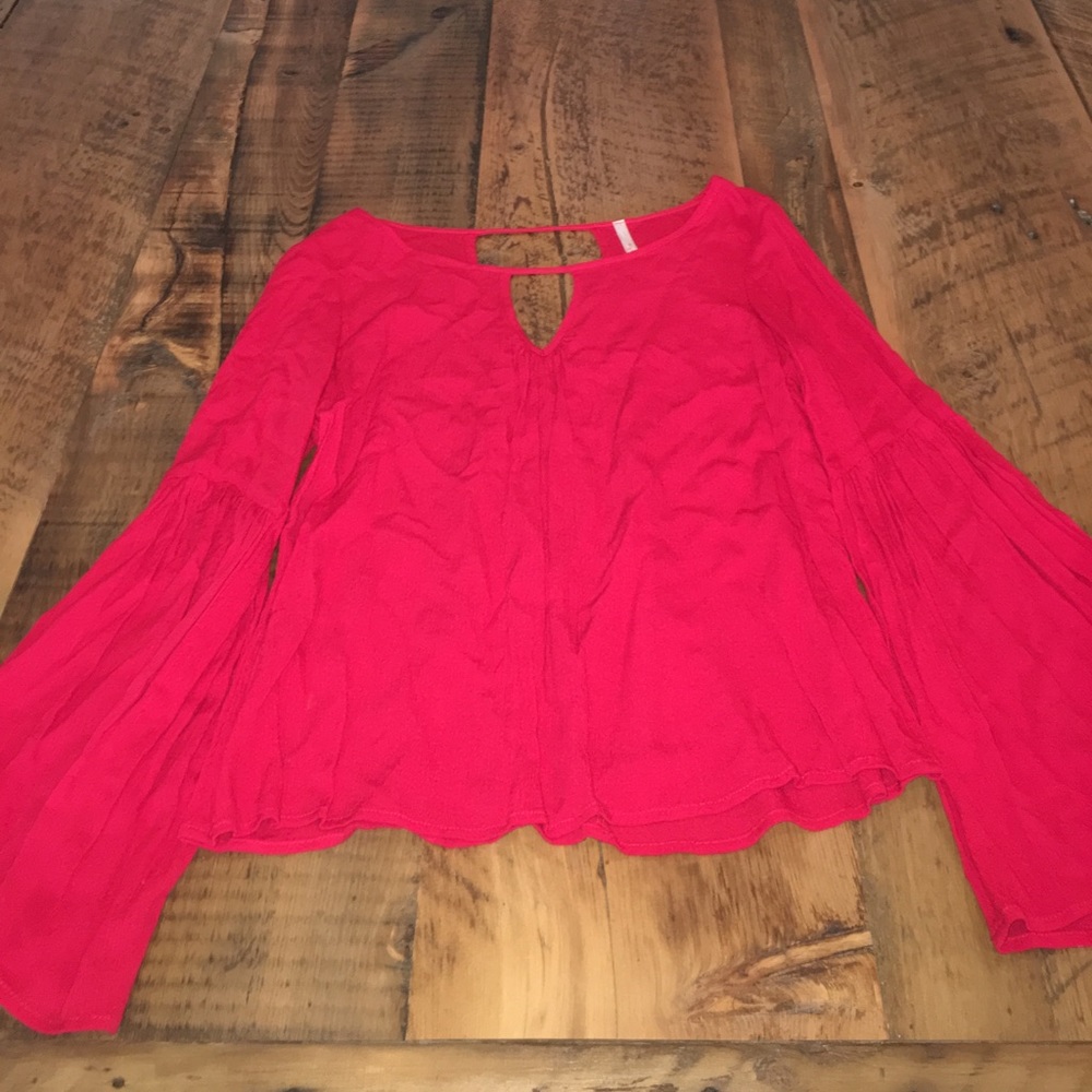Key hole front and back cutouts will bell sleeves