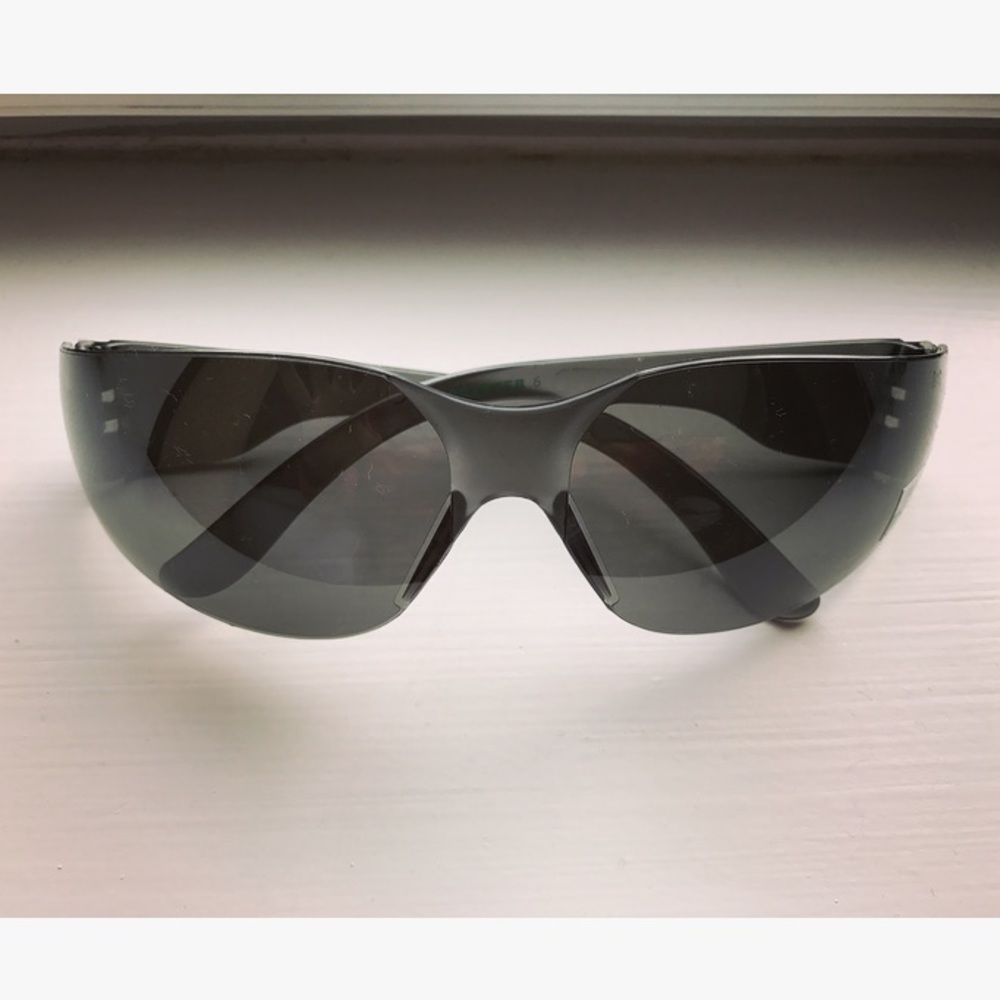 Black curved wraparound frame safety glasses
