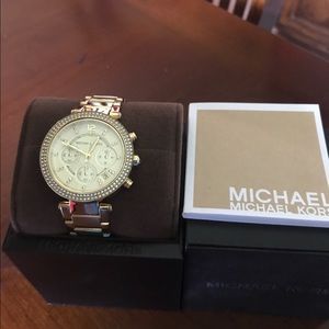 MK woman's gold watch