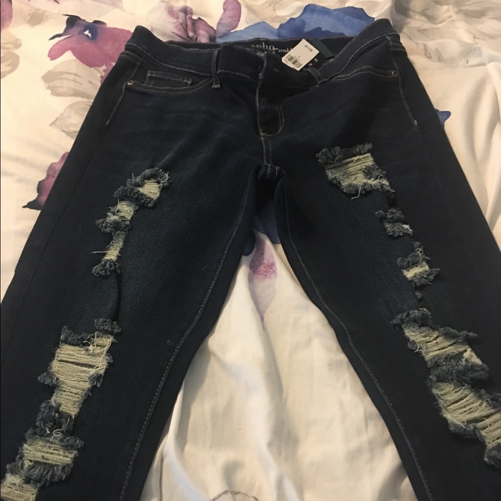 Women's Dark rinse distressed skinny jeans.