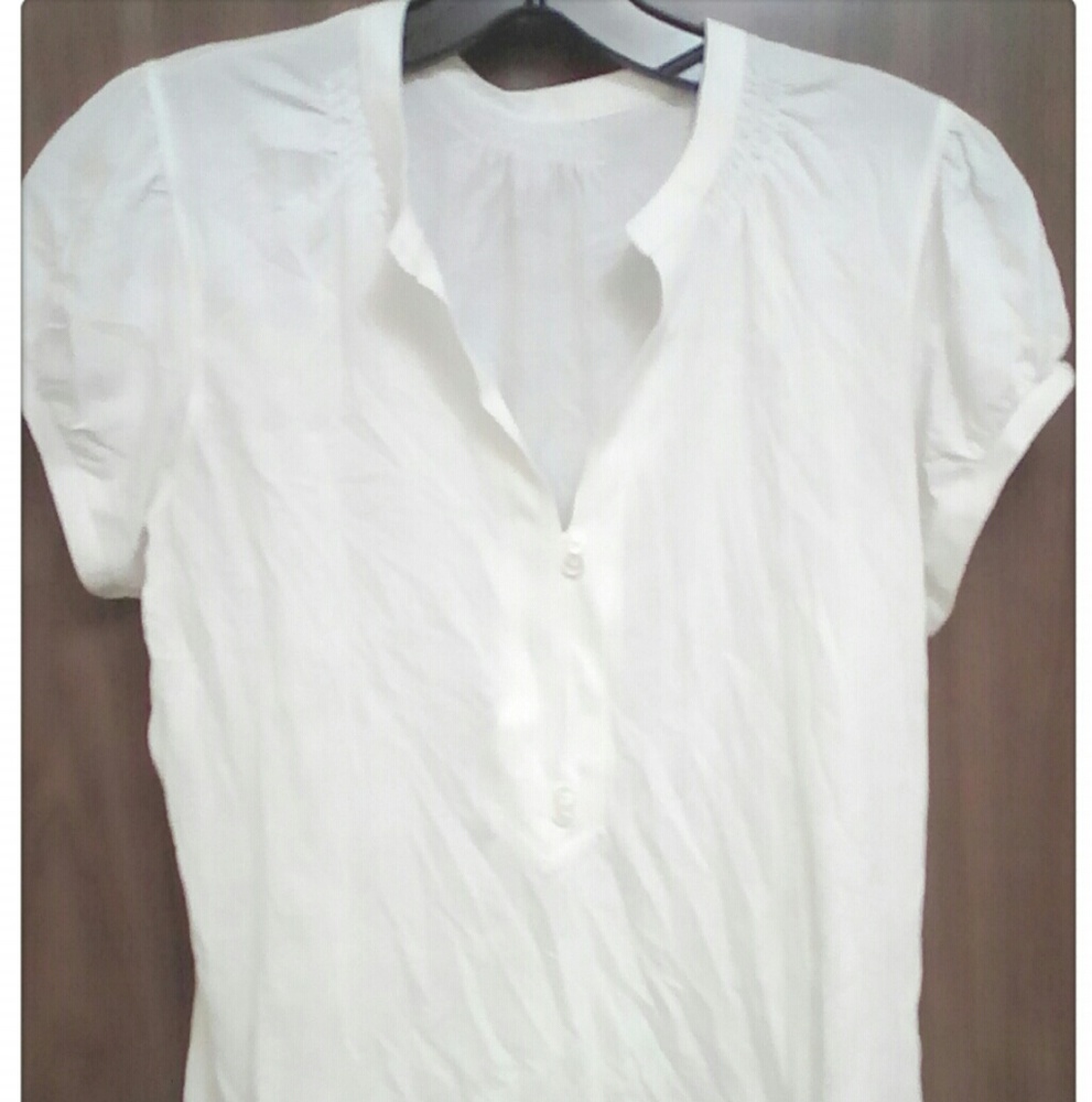 Ladies white t-shirt with ruffled shoulders-