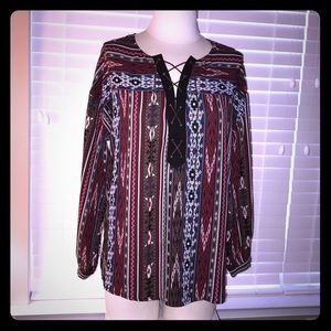 Burgundy tribal print lace up long sleeve top.