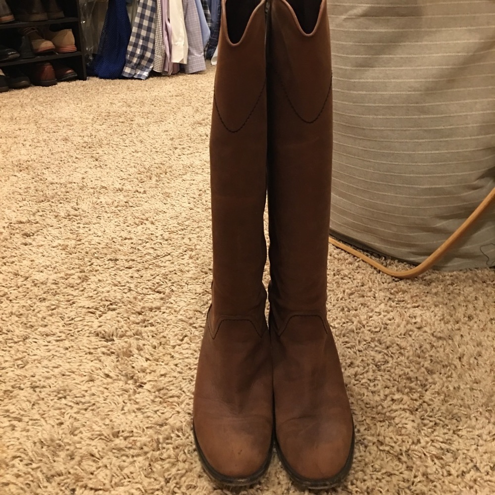 Chanel knee high leather boots.