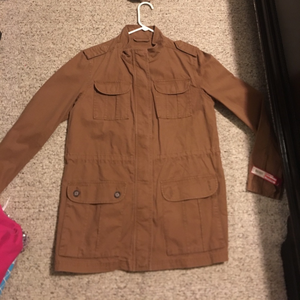 Brown jacket and it says it a L but fits like a M