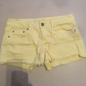 American Eagle yellow denim cut-offs. Size 8 midi