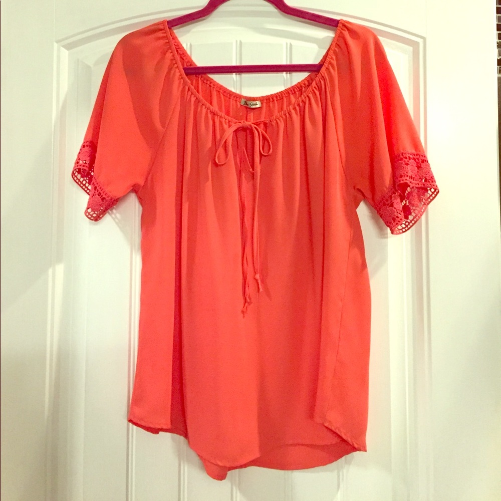 Coral boutique top with beautiful crochet sleeves