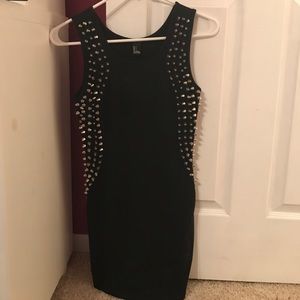 Tight studded little black dress