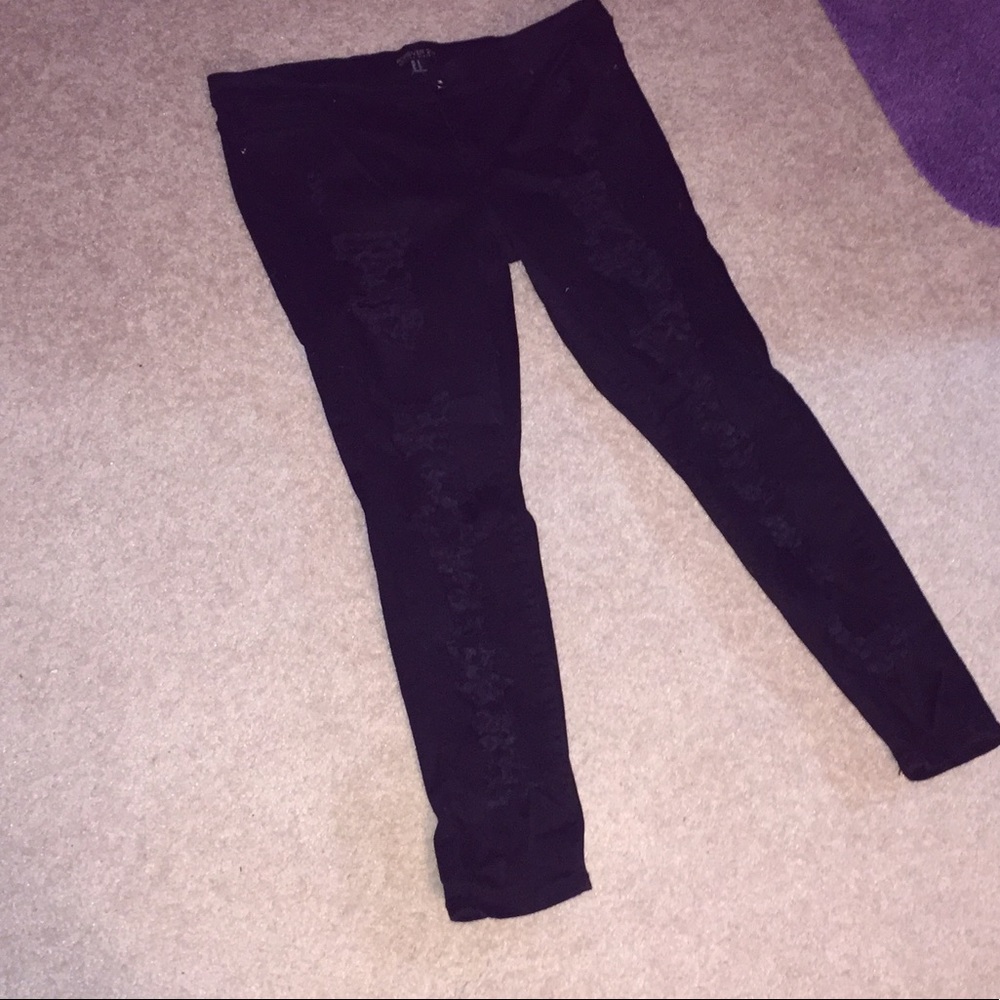 Black distressed denim / ripped jeans