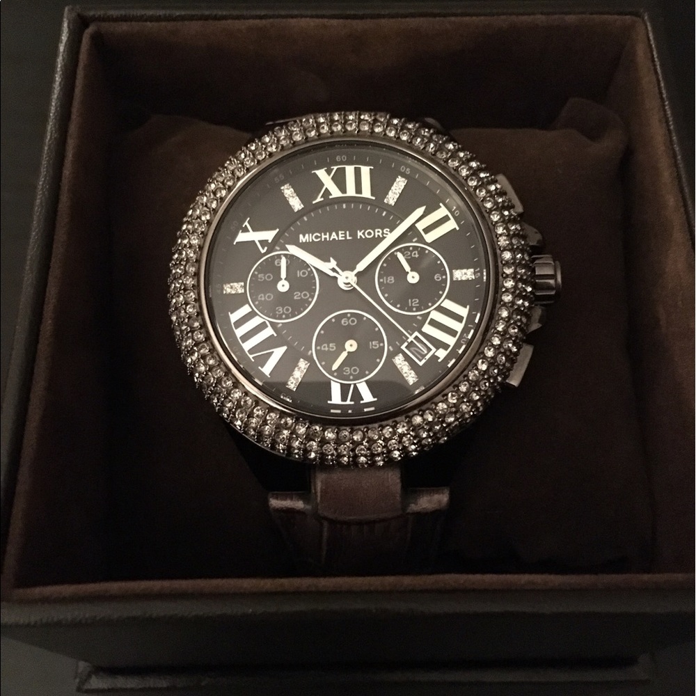 Silver / Gray, round face Michael Kors watch.